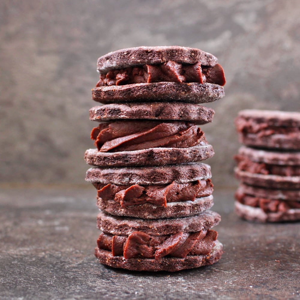 Two stacks of Vegan Chocolate Sandwich Cookies