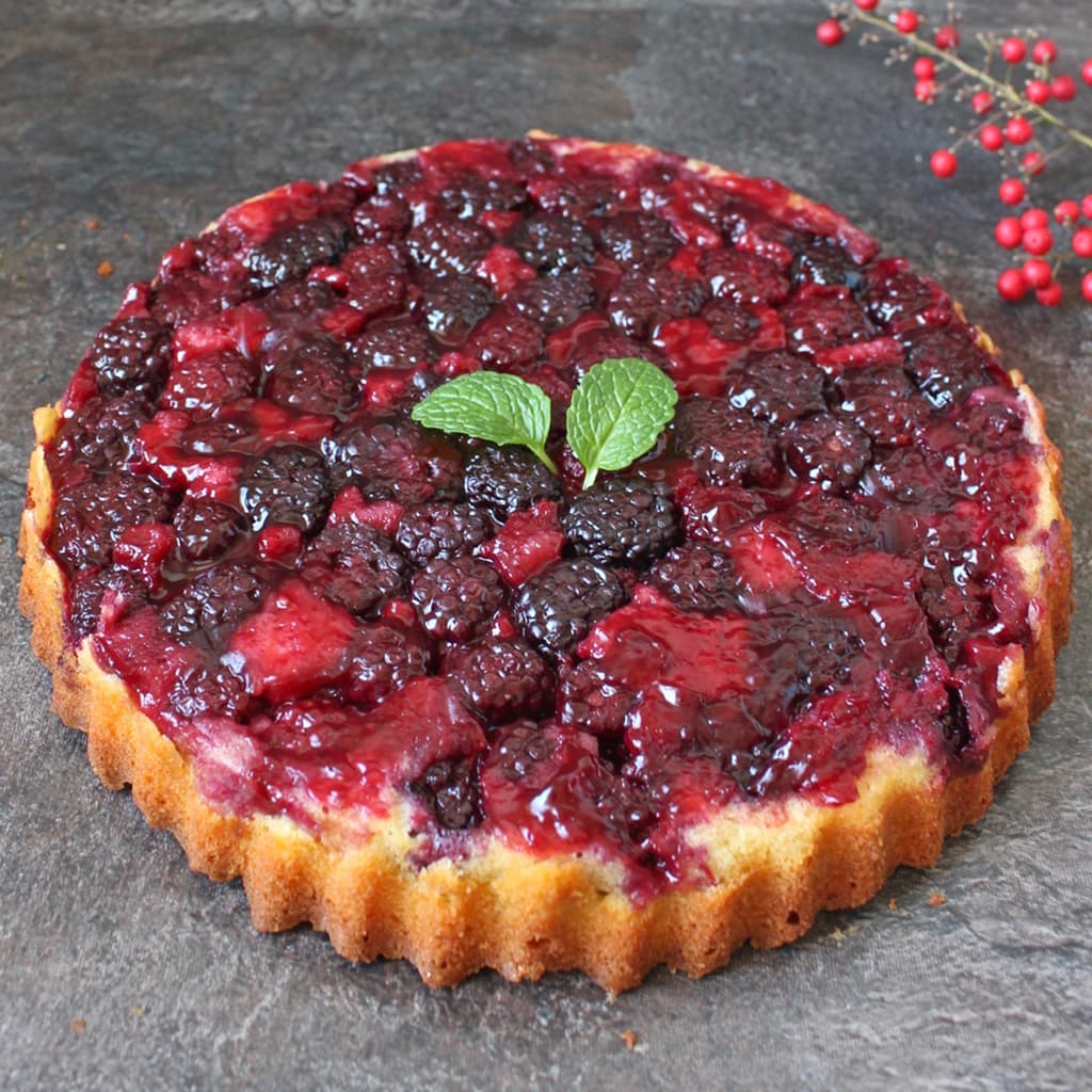 Blackberry Upside Down Cake on a grey surface.