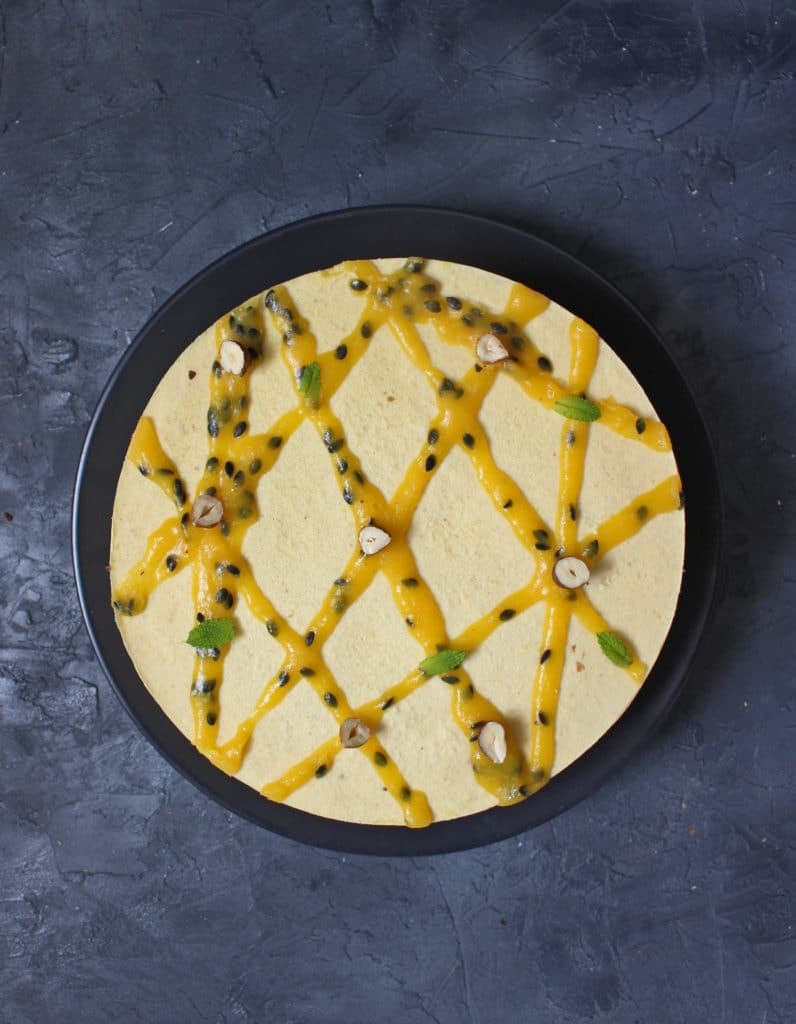 Cake from above on a black plate over a dark grey surface