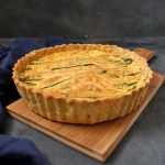 Feta and Asparagus Quiche on a wooden board