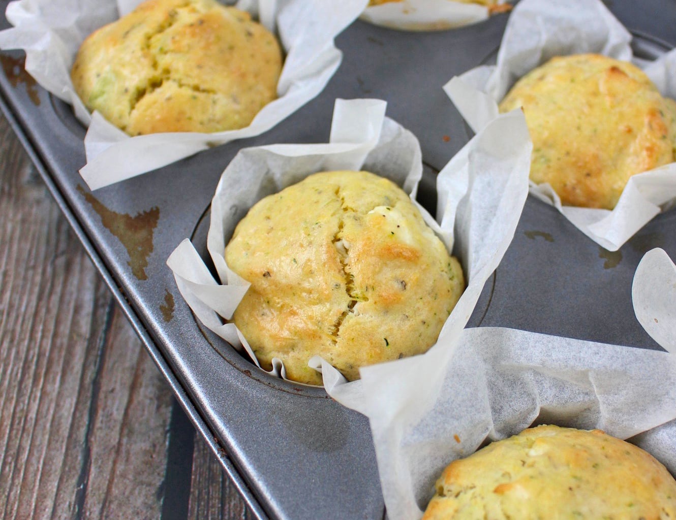 Cheese Zucchini Muffins in the muffin tray.