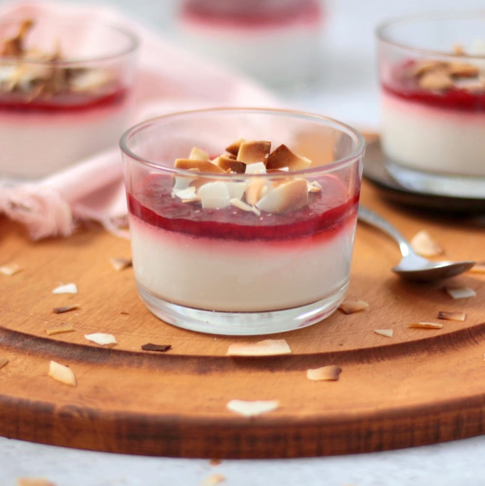 Close up on the Panna Cotta in a glass cup on a wooden board