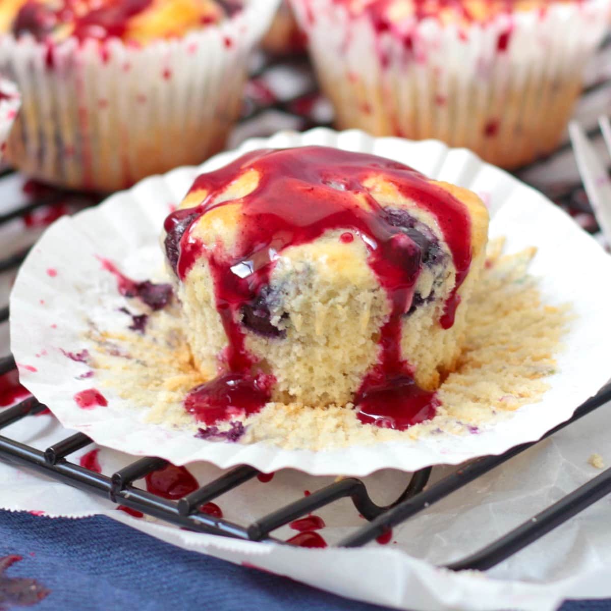 Lemon Blueberry Muffin over the paper case topped with Glaze