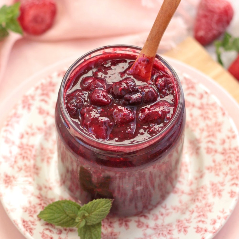 45' Angle View on the Mixed Berry Compote in a glass jar