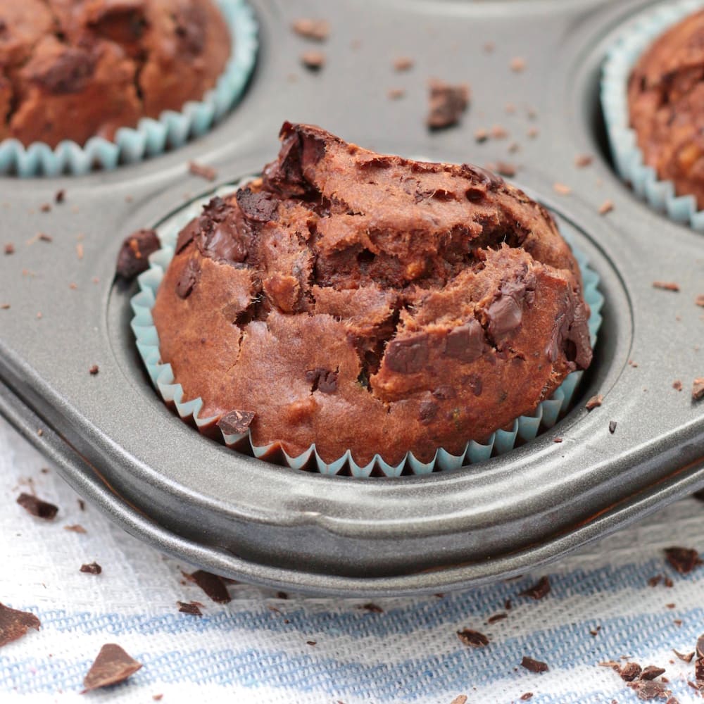 One Chocolate and Zucchini Muffin in the muffin pan