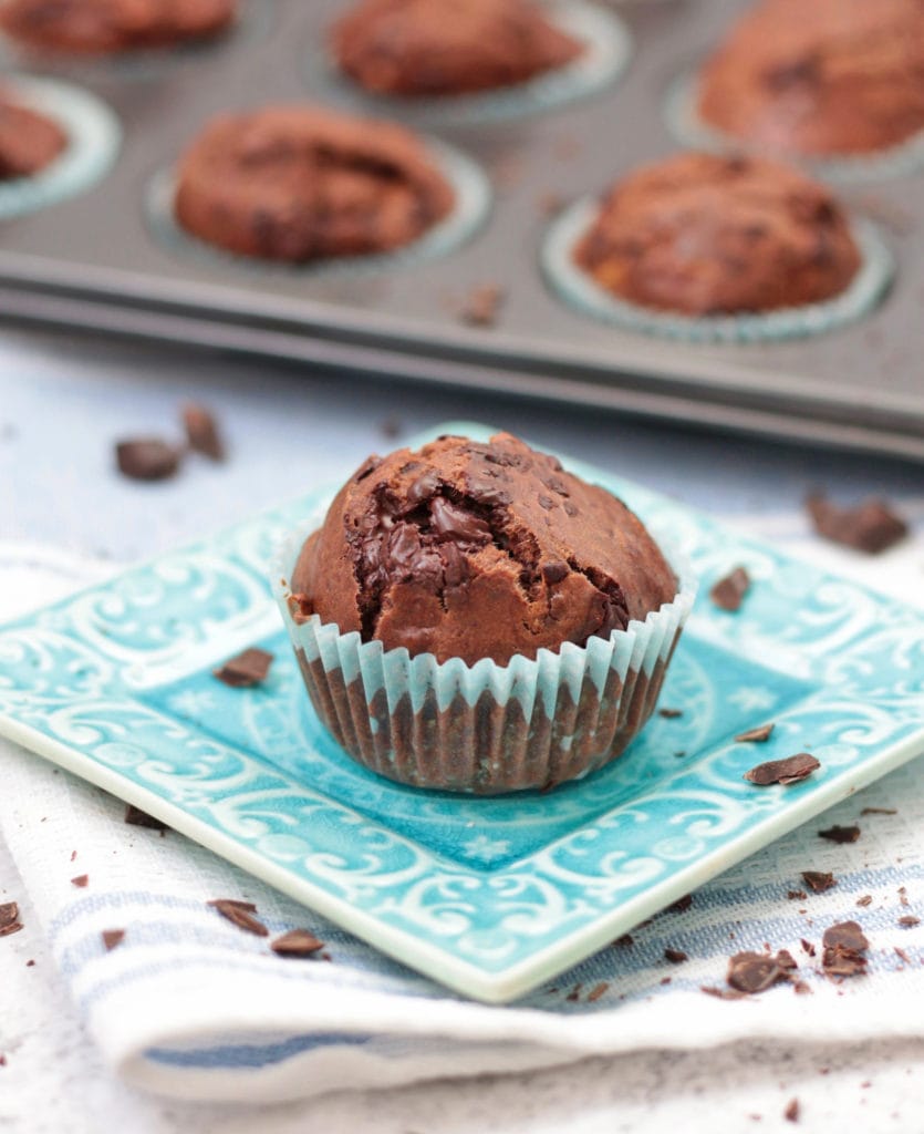 One Muffin over a small square blue plate