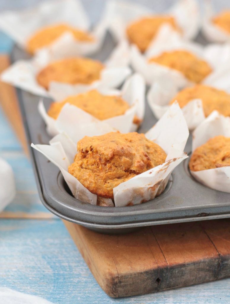 close up on a carrot muffin in the pan.