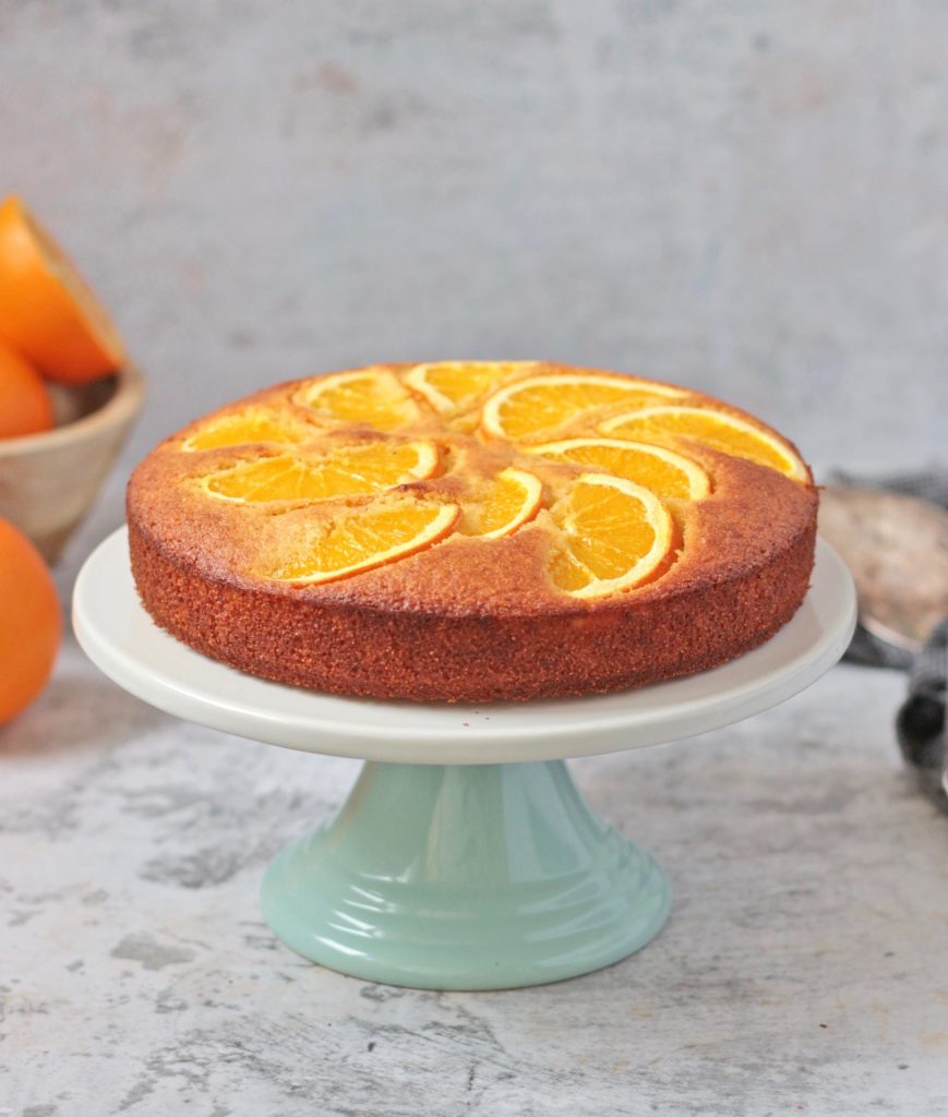 Orange Semolina Cake on a cake stand