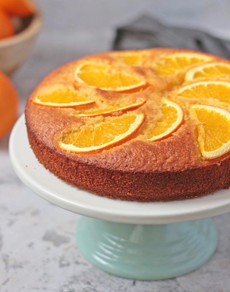 Close up on the fresh orange slices over the cake