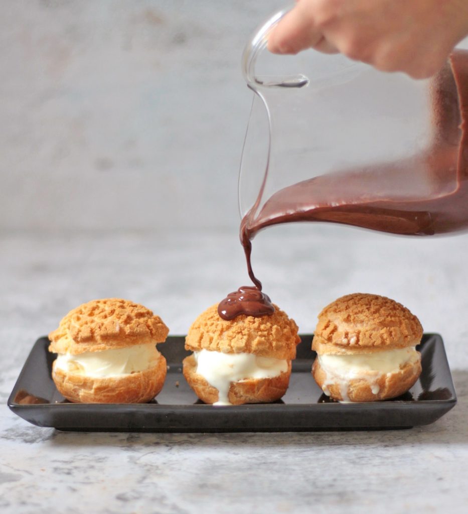 Pouring Chocolate Sauce over the Ice Cream Choux.