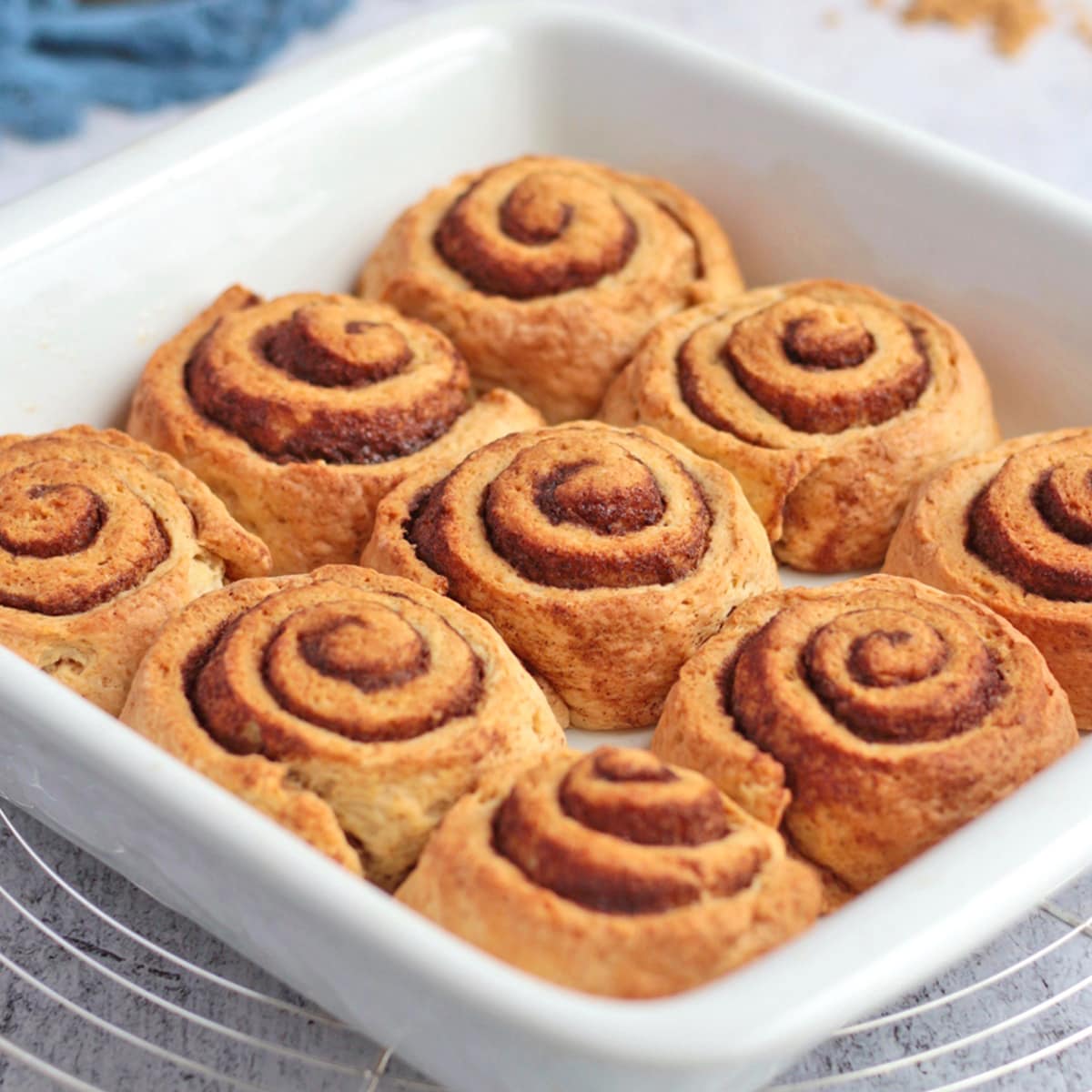 9 rolls in a white ceramic baking dish