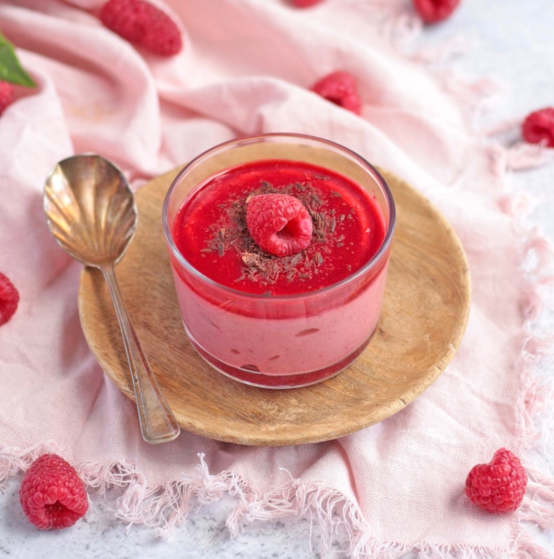 Close up on the mousse topped with a raspberry.