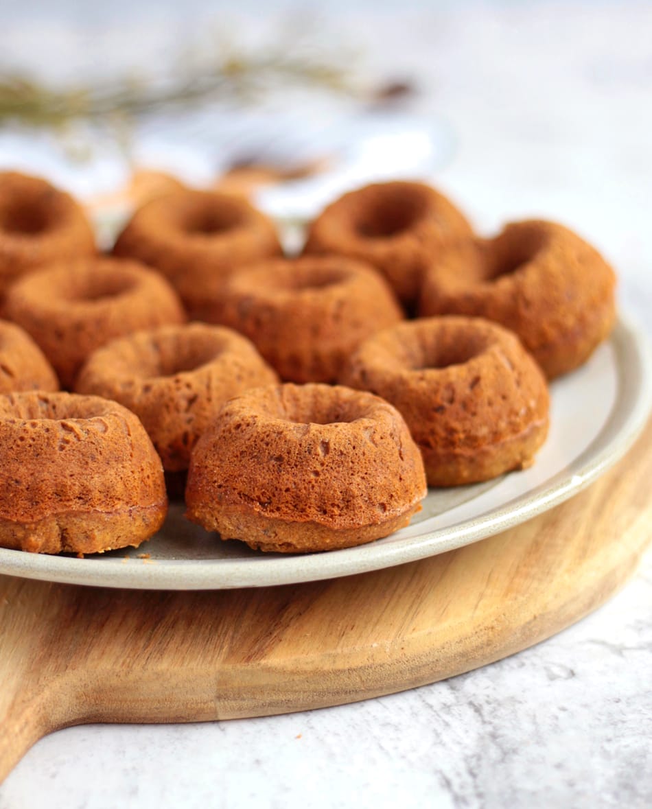 Close up on the vegan sticky toffee puddings on a plate.