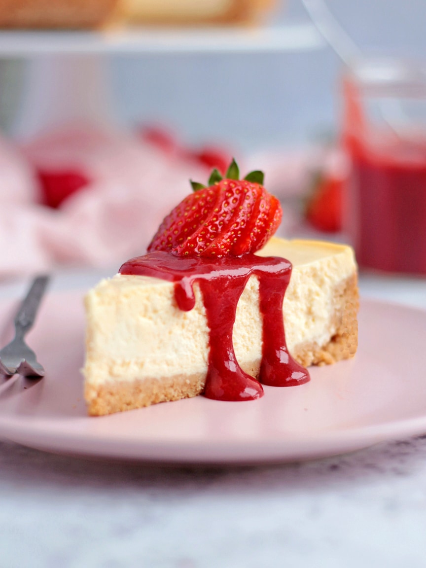 Slice of Cheesecake topped with Strawberry Sauce