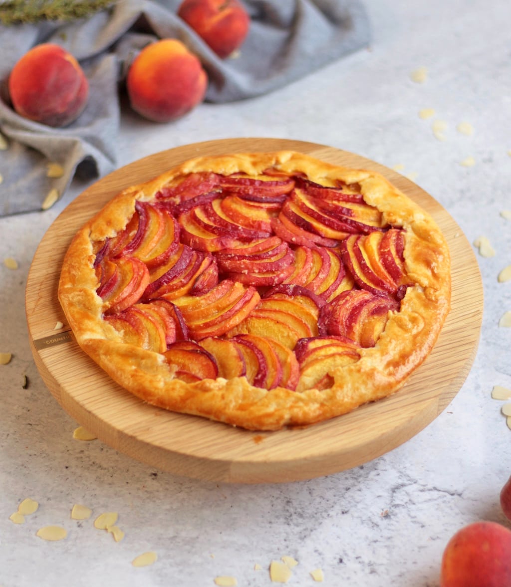 Full Peach Galette on the wooden cake stand