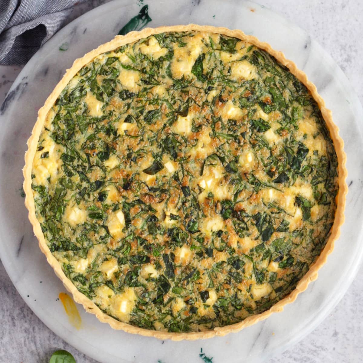 Quiche from above on a marble plate