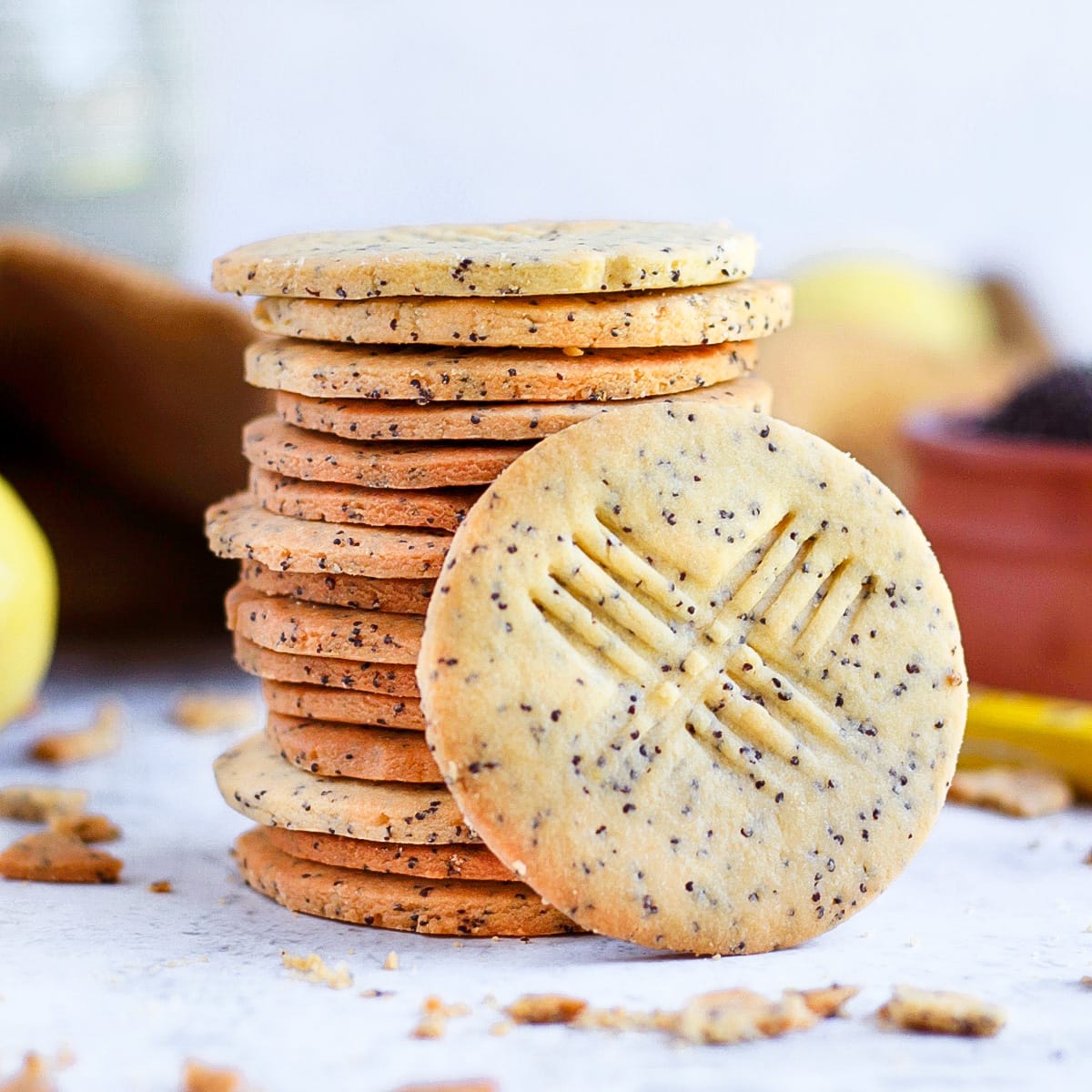 One cookie leaning on a stack of shortbread