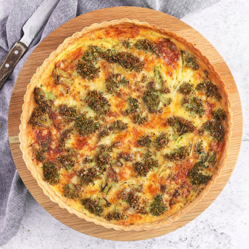 Broccoli Quiche from above on a wooden board