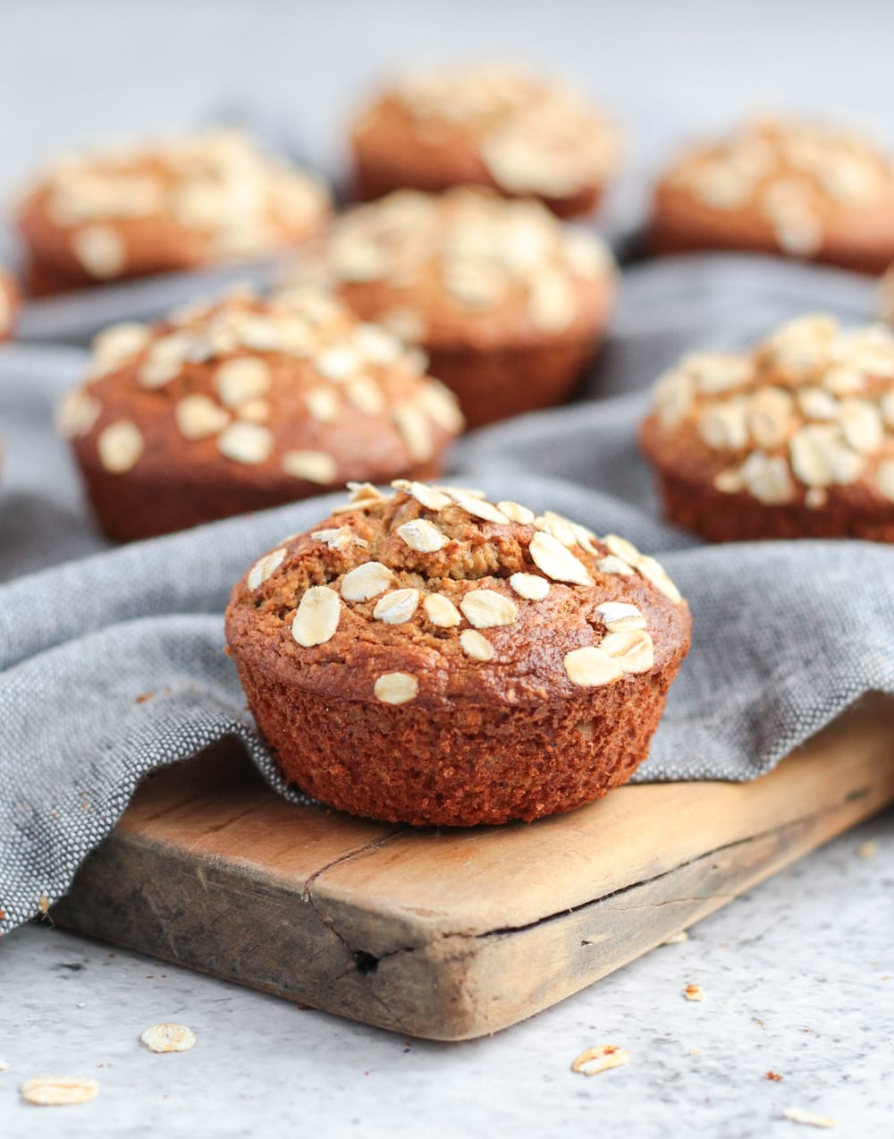 Oatmeal Muffin on a wooden cutting board.