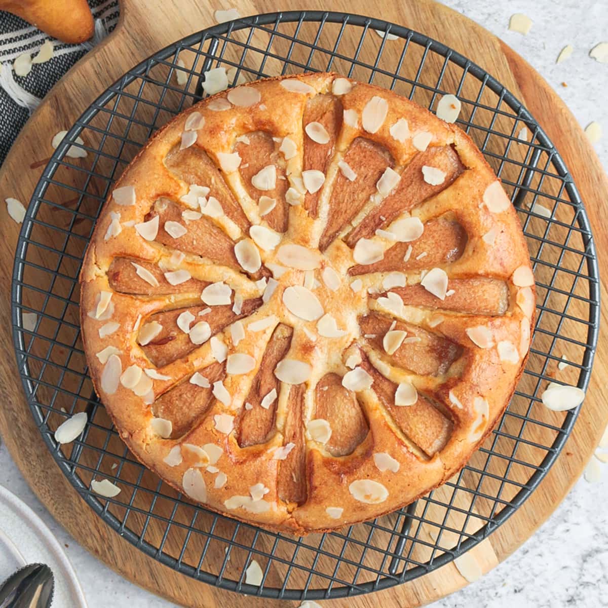 Pear Almond Cake from above on a cooling rack.