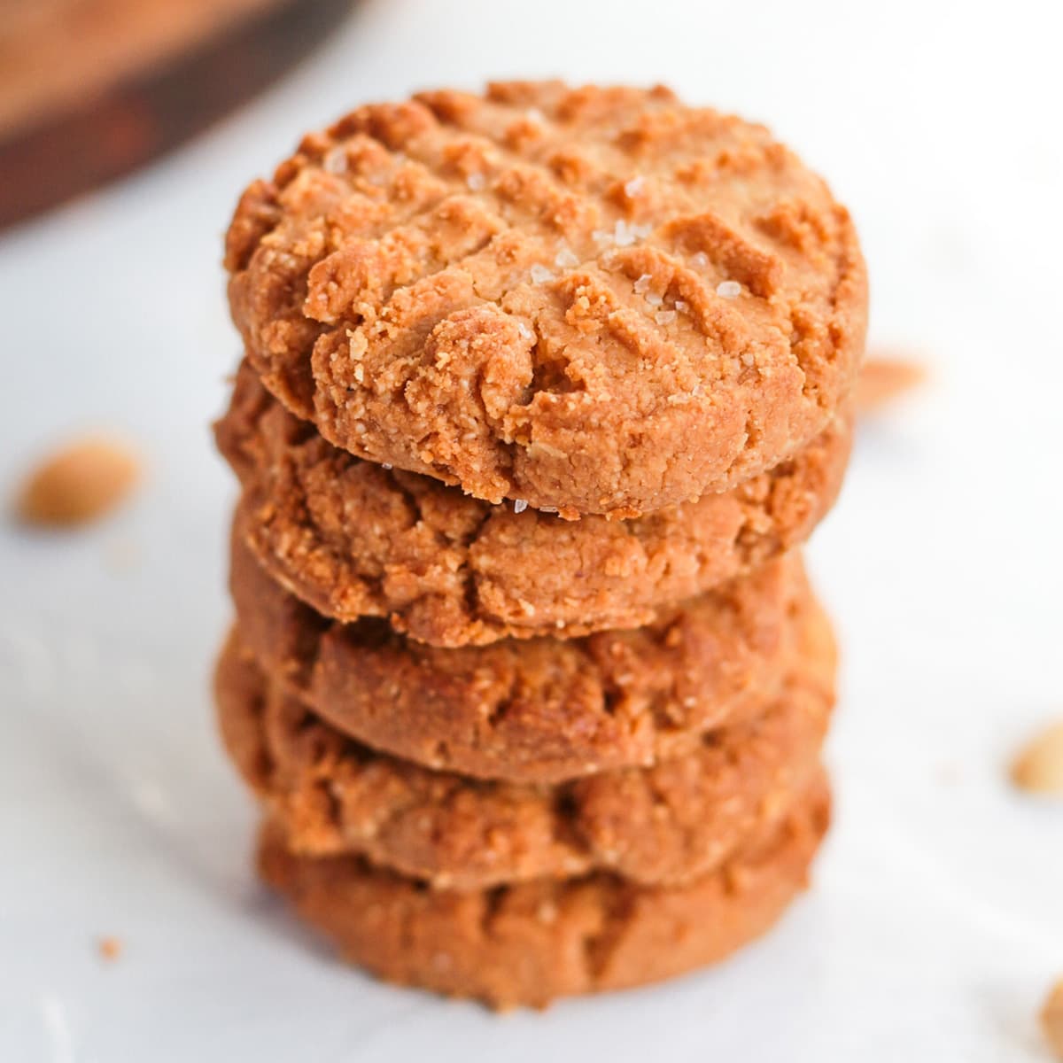 Stack of 4 cookies on a white surface.