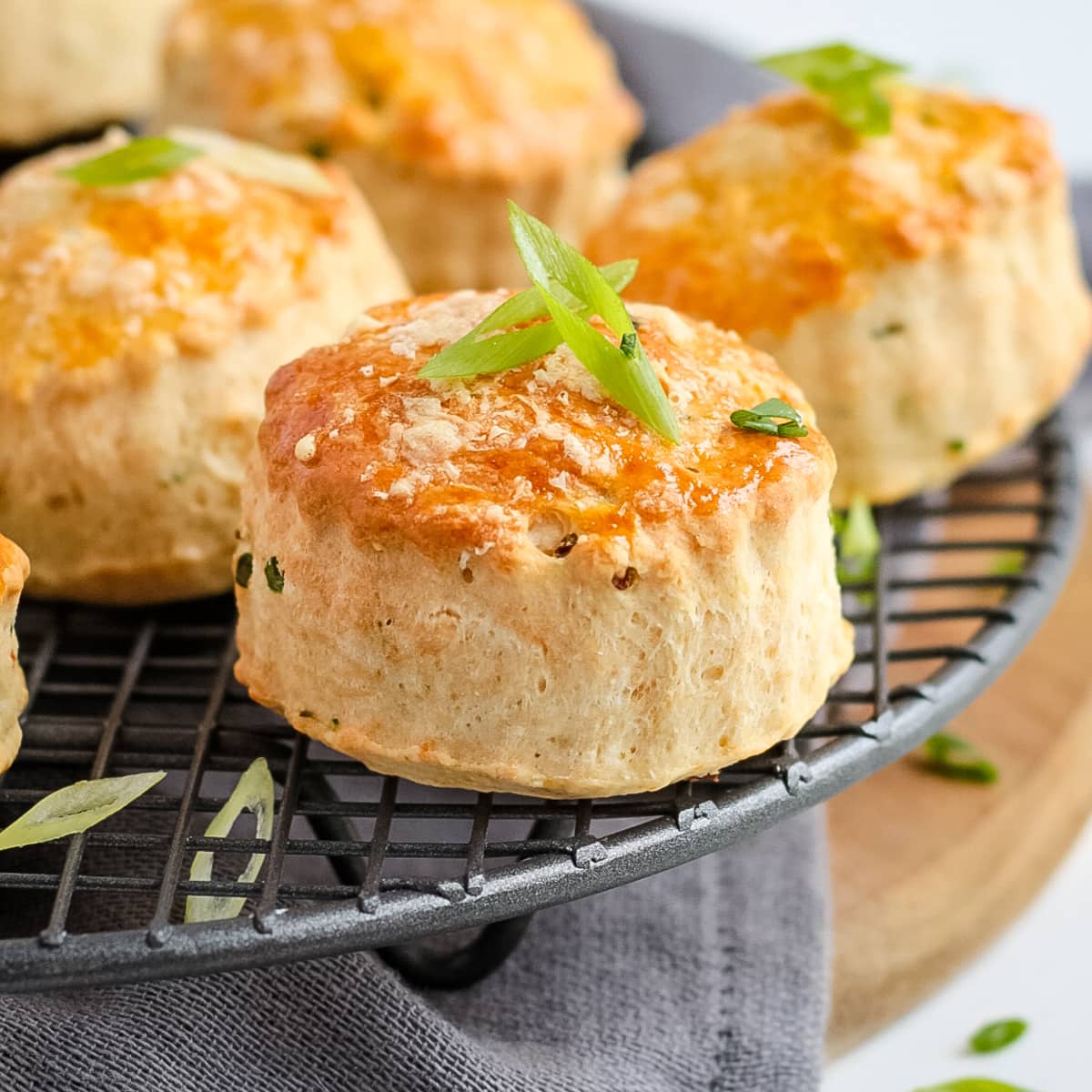 Close up on one scone topped with chopped spring onion