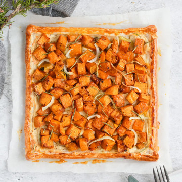 Pumpkin tart from above over a sheet of baking paper