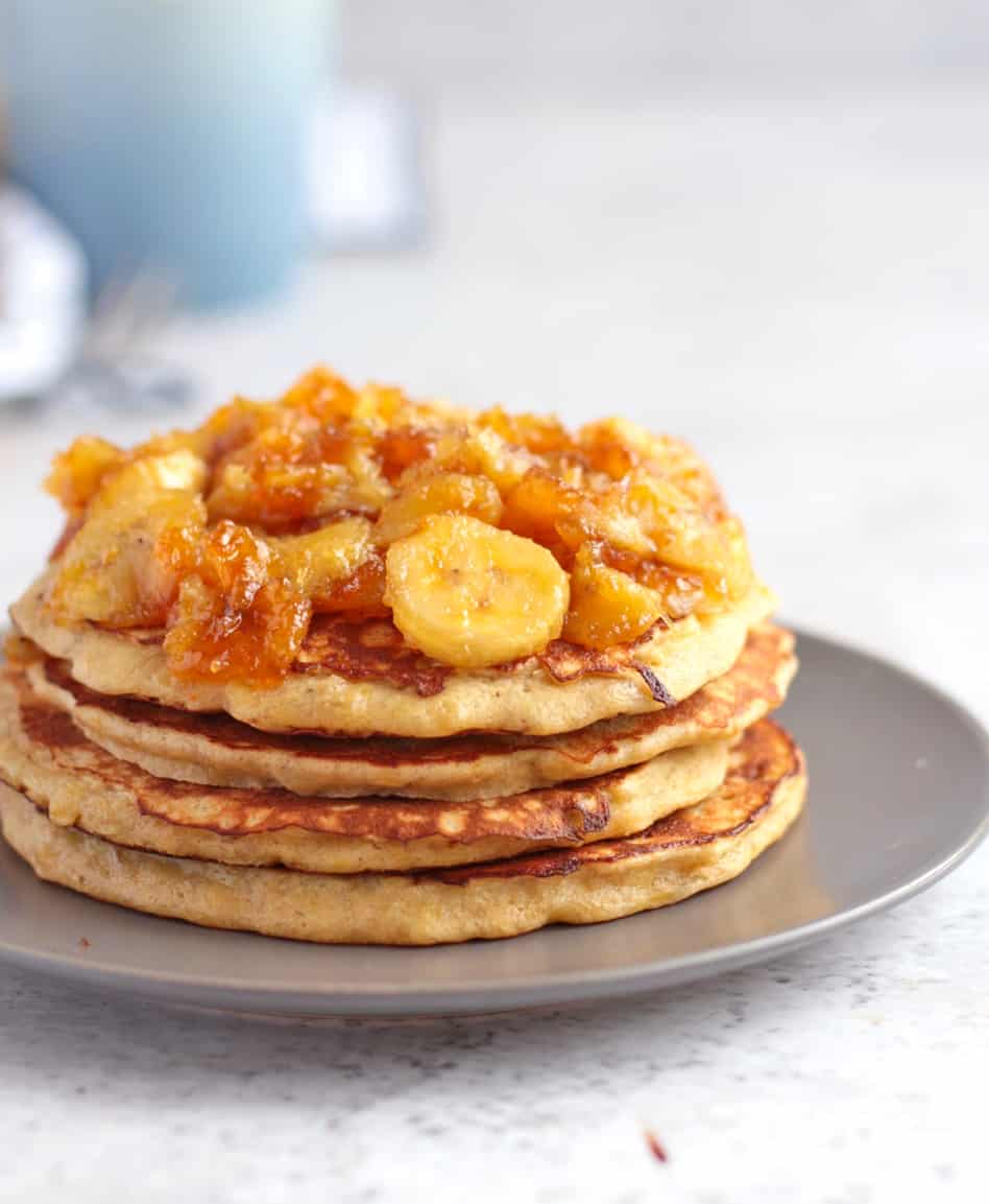 Close up on the side of the pancakes topped with the caramelised banana topping.