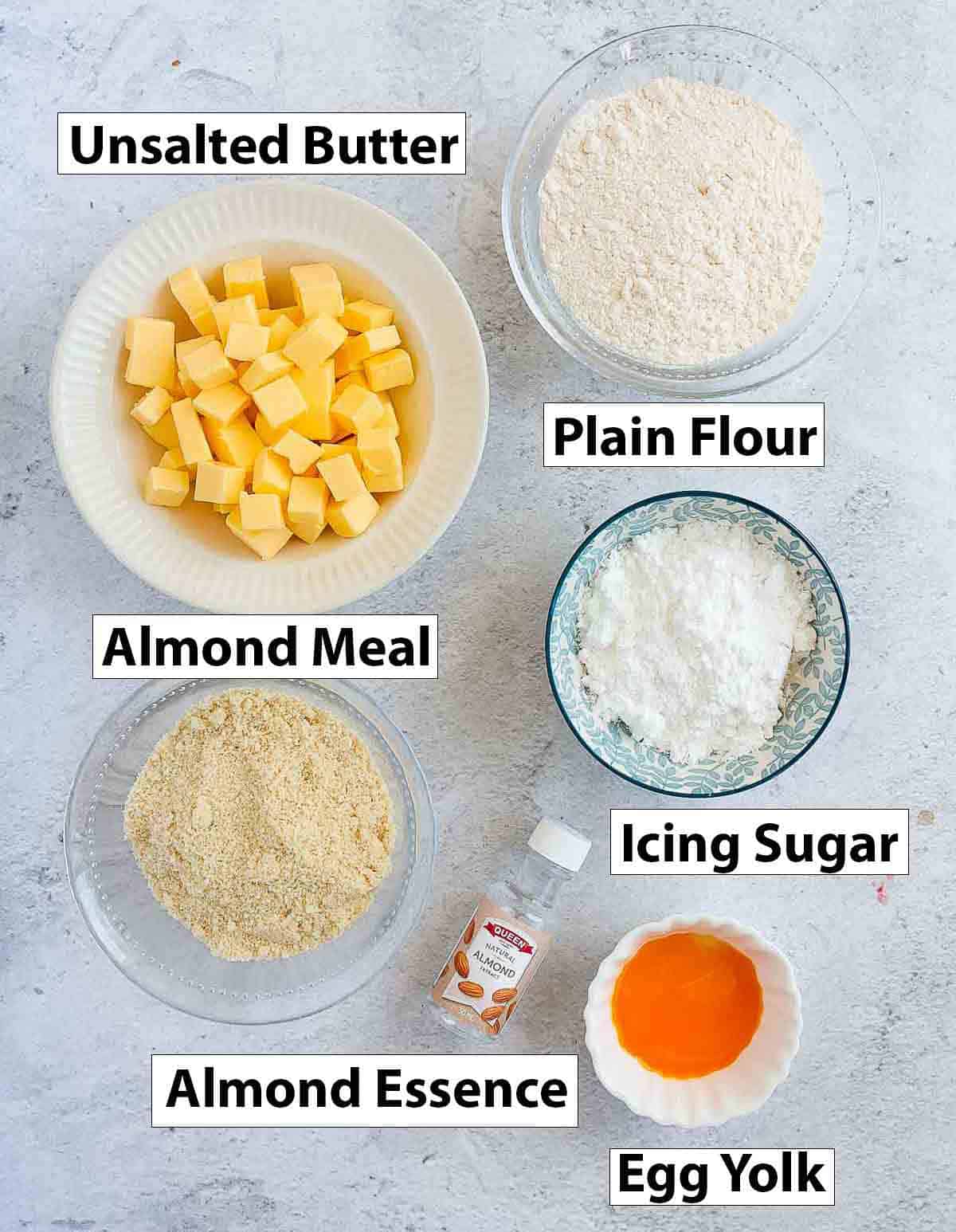Ingredients placed over a grey surface.