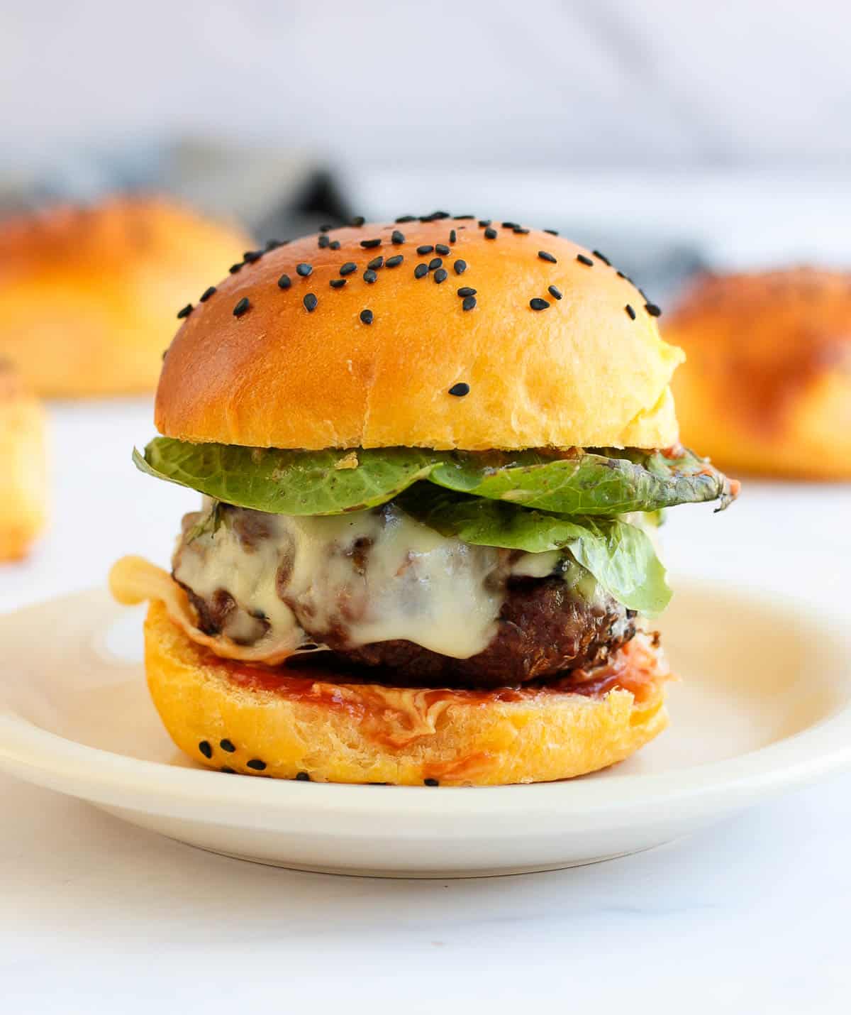 Plated Hamburger made with a sweet potato bun.