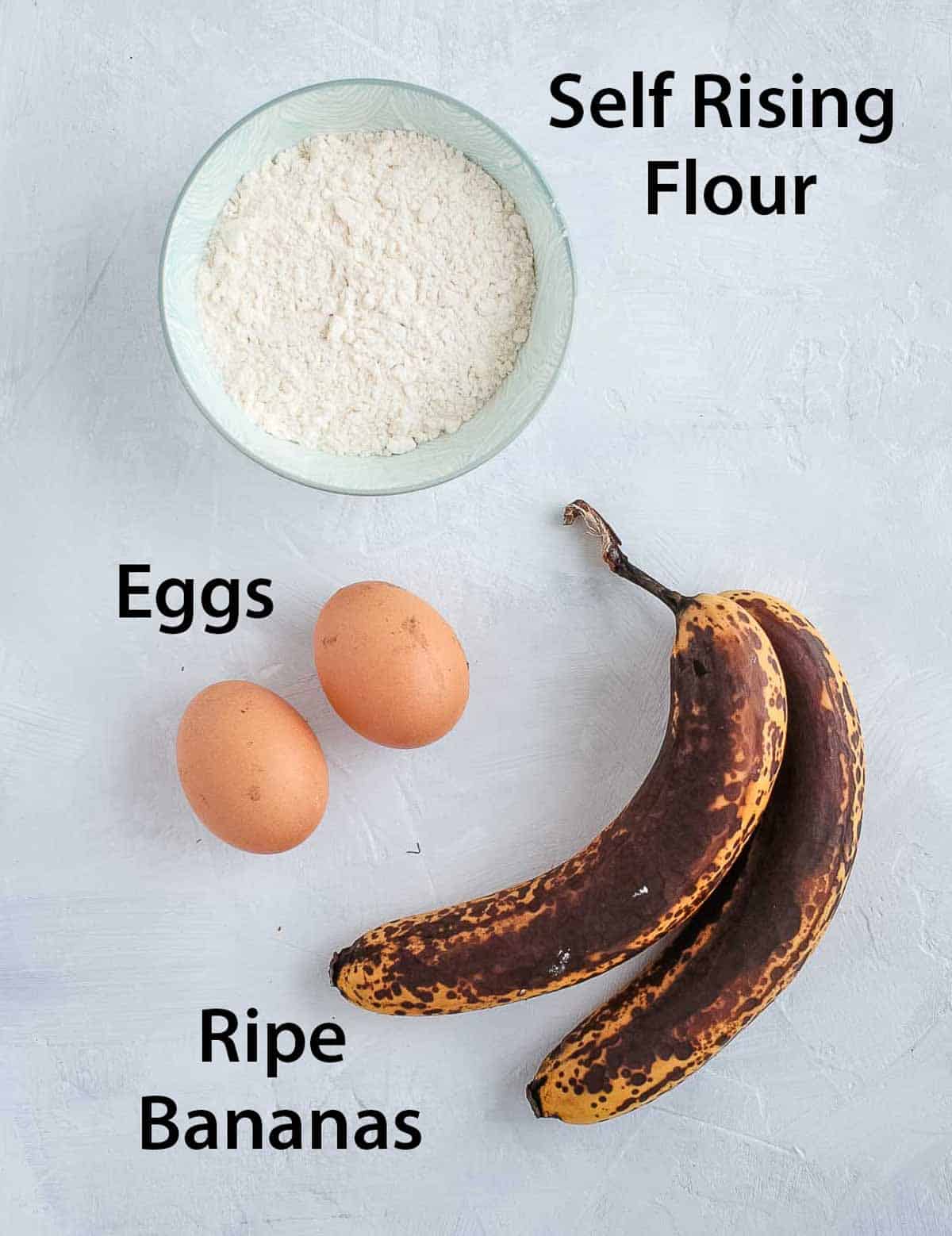 Ingredients placed on a white surface.