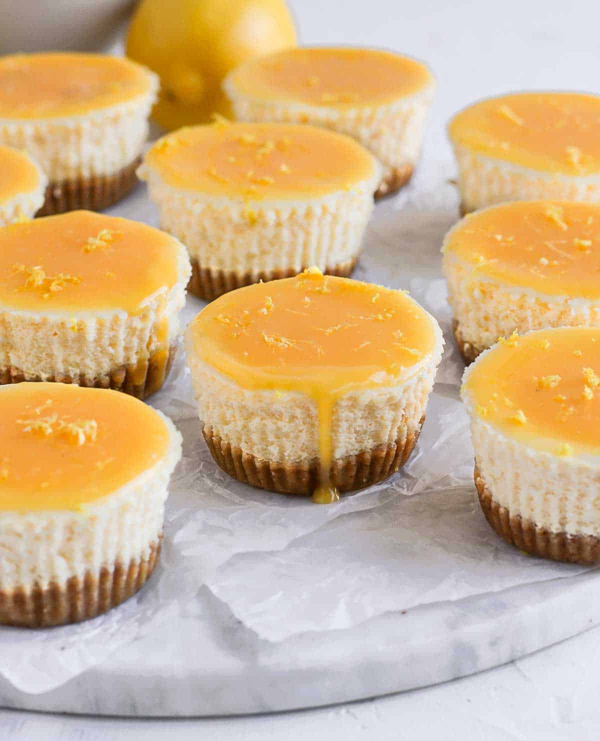 Lemon Curd pouring over a cheesecake.