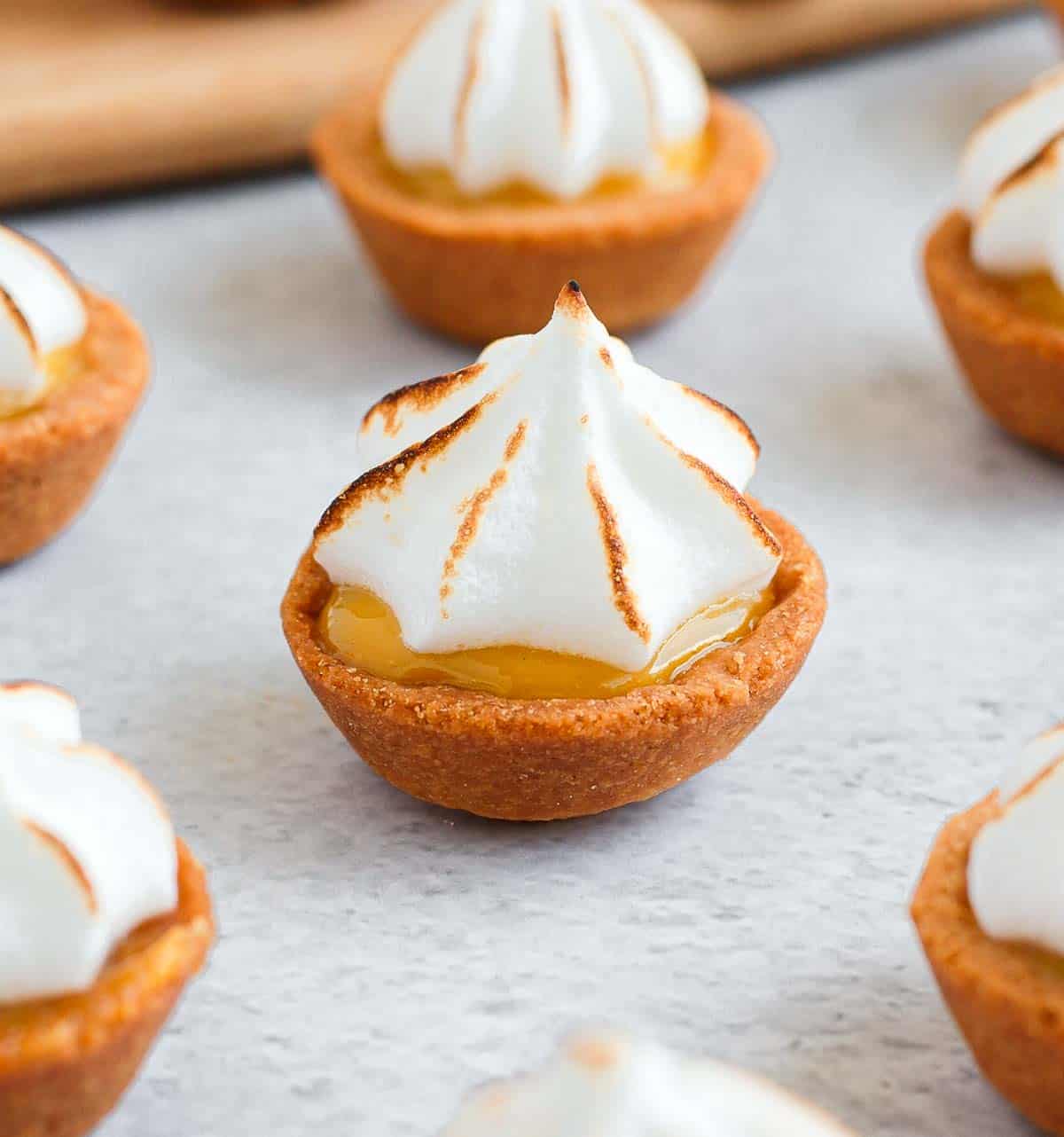 Tartlets on a grey surface.