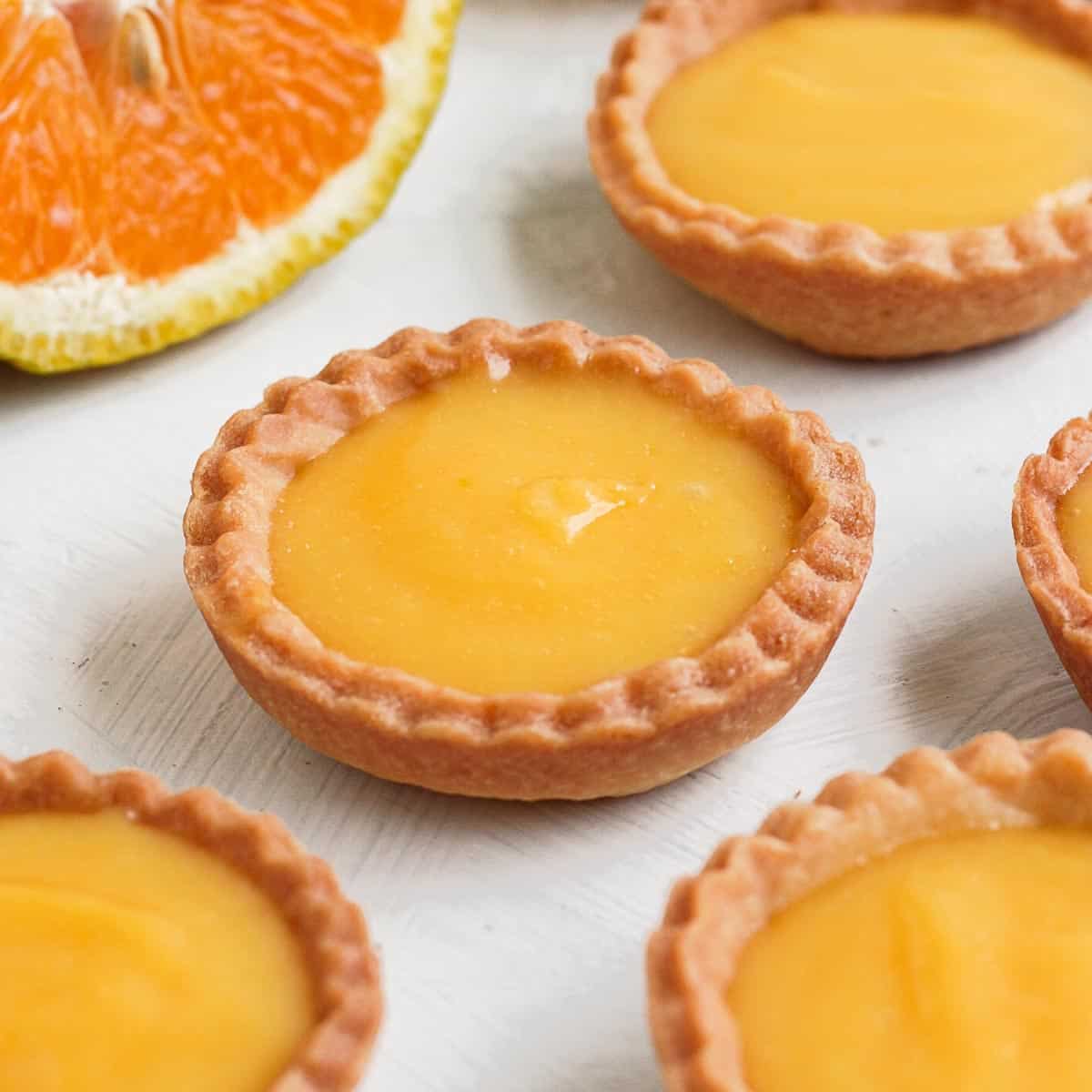 Close up on one orange tartlet.