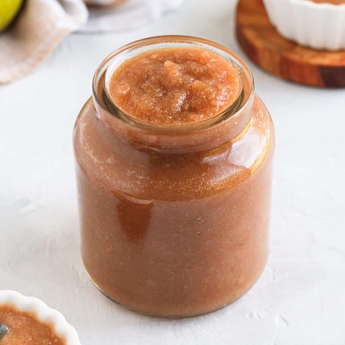 Close up on the pear sauce in a glass jar.