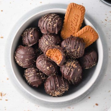 Truffles from above in a grey bowl with biscoff cookies.
