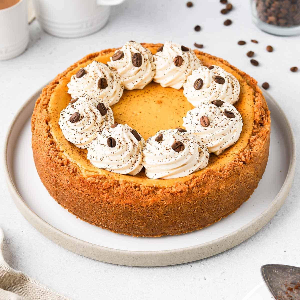 Coffee Cheesecake on a round white plate.