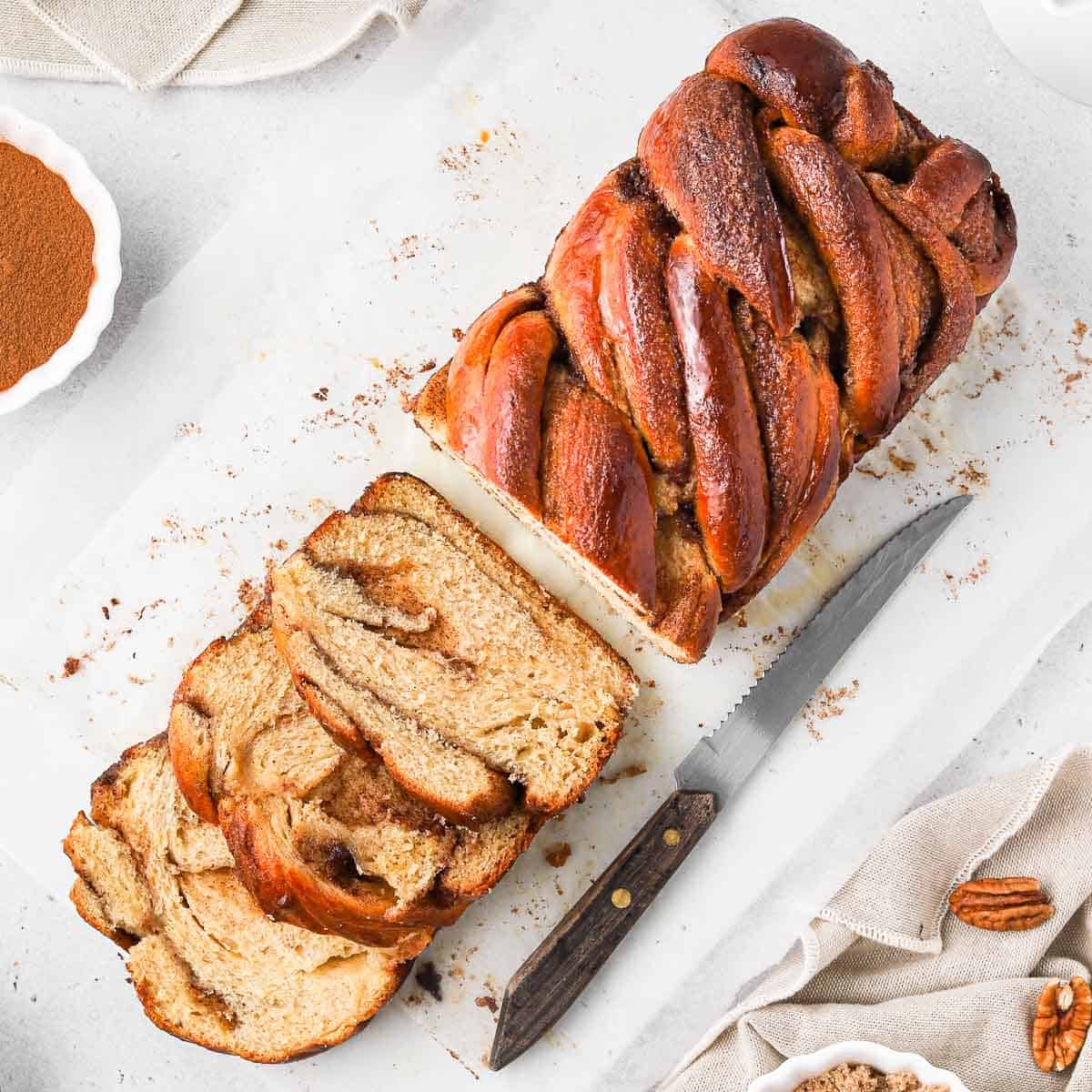 Cinnamon Babka seen from above with 3 slices cut off.