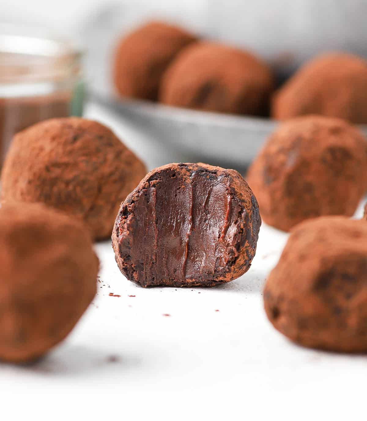 Close up on one truffle with a bite taken off.