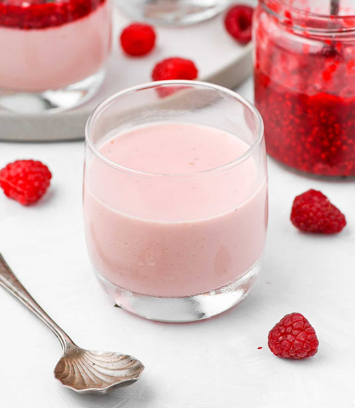 Raspberry cream set in a glass cup.
