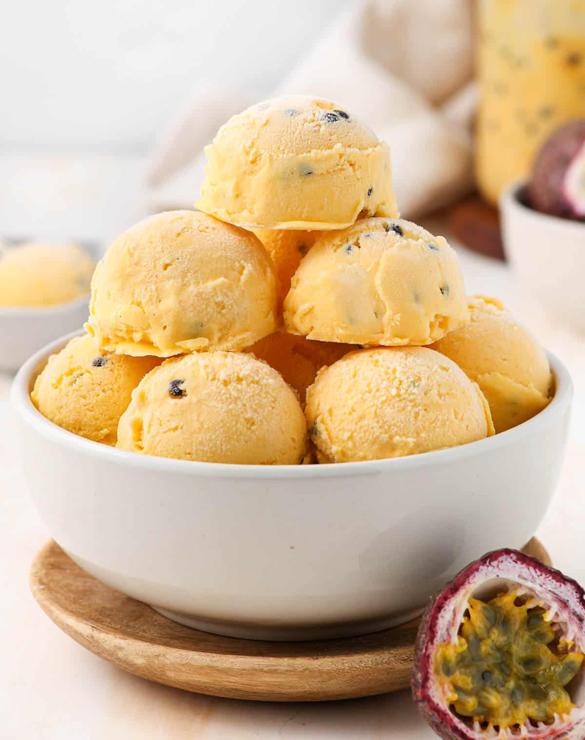 Stacks of ice cream scoops in a white bowl.