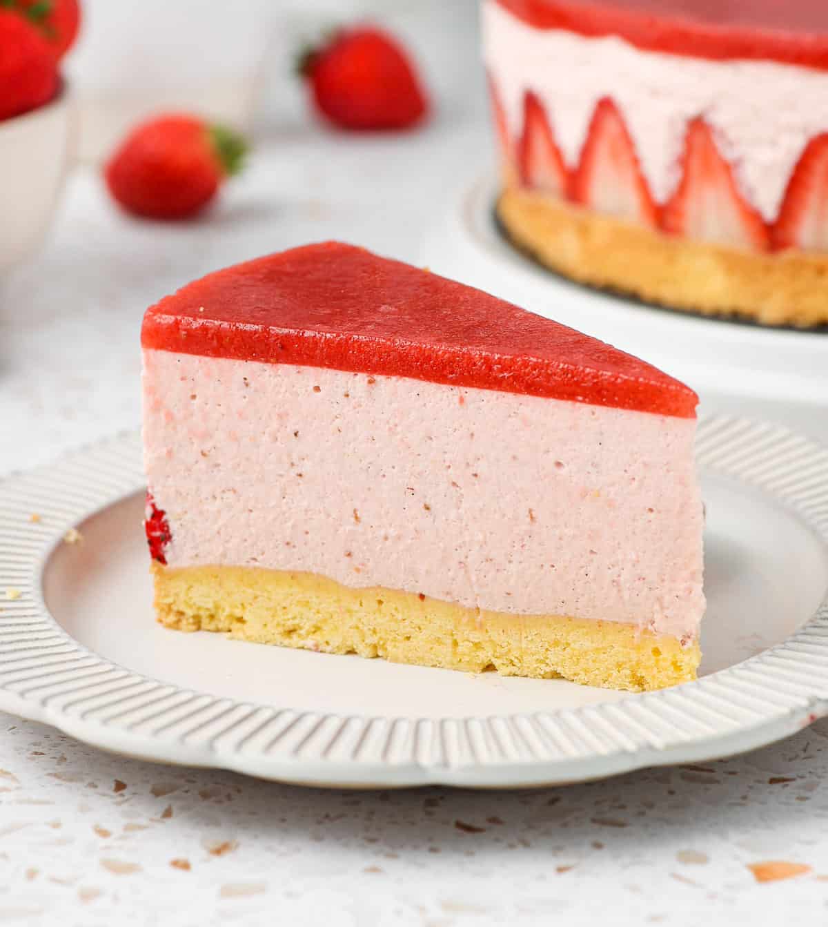 One slice of cake on a small white plate.