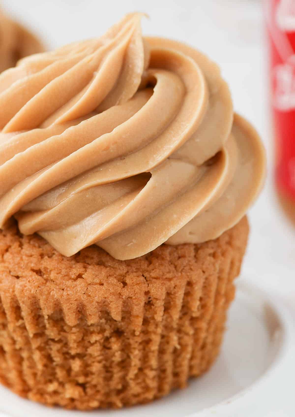 Close up on the frosting piped over a cupcake.