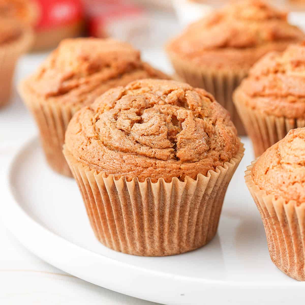 Close up on a biscoff muffin on a large white plate.