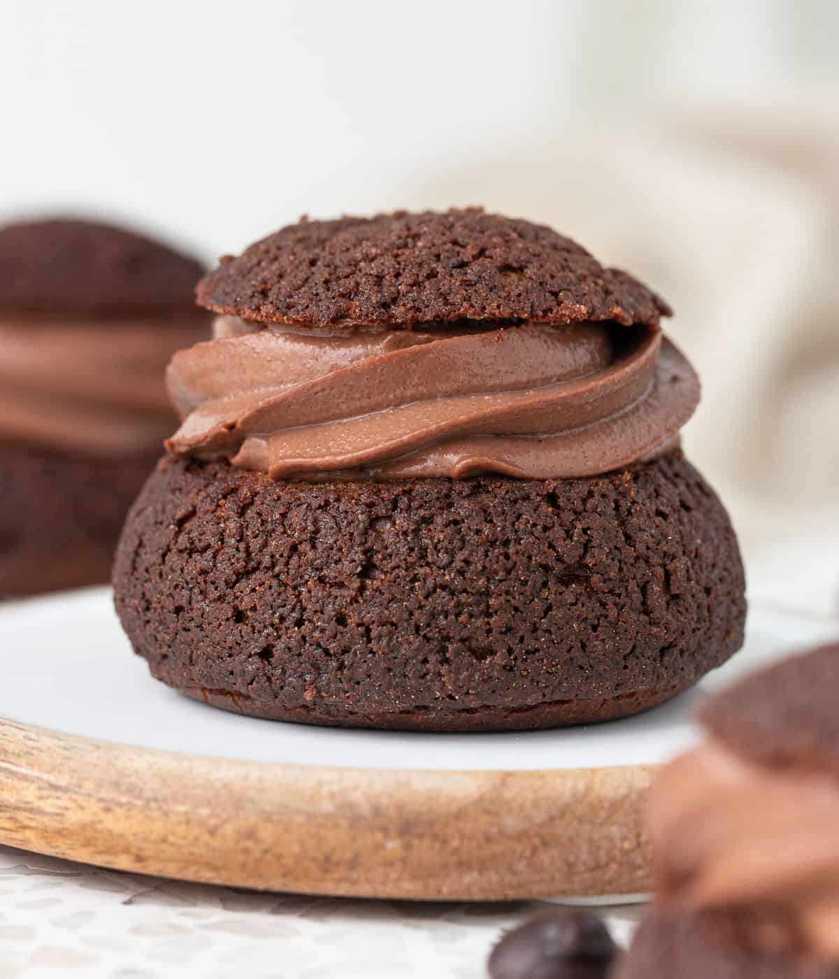 Chocolate choux au craquelin filled with chocolate pastry cream.