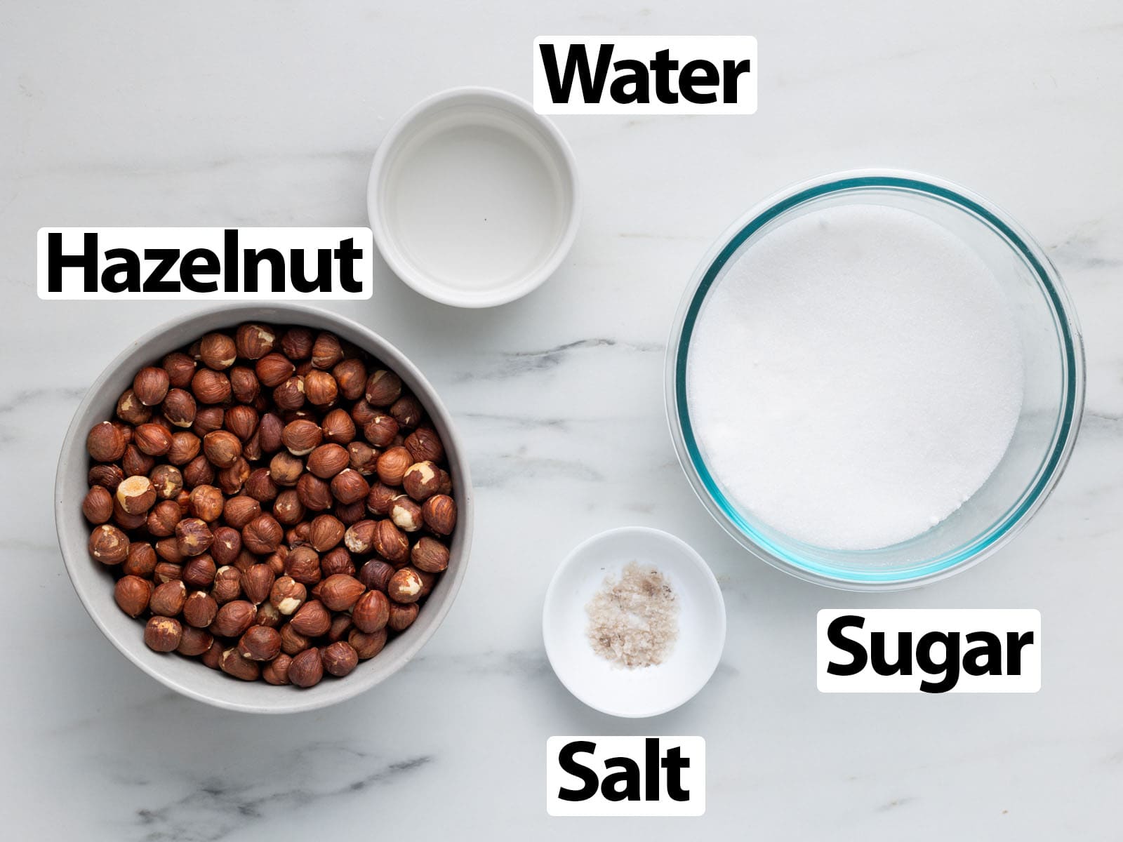 Ingredients laid on a marble surface.