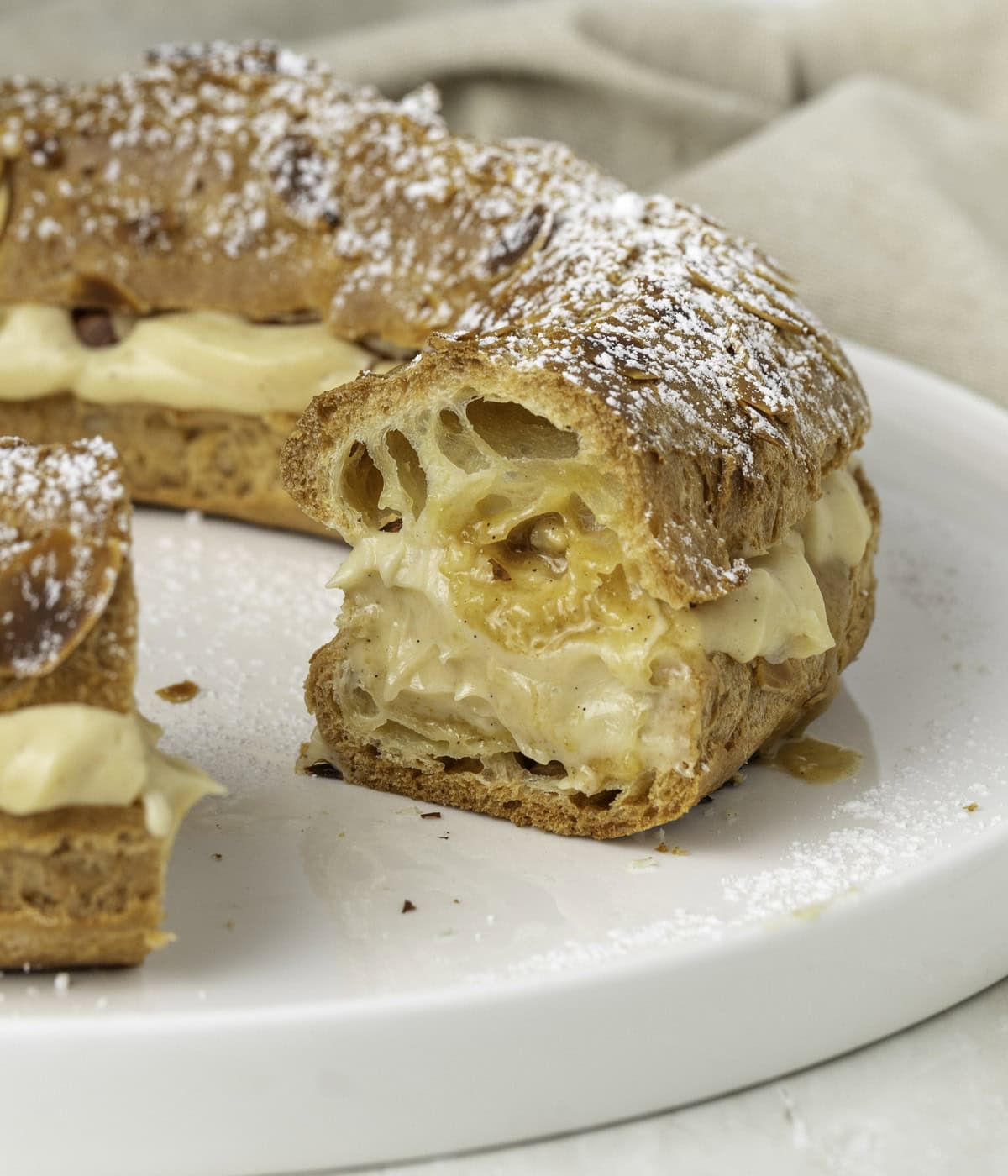 Praline cream piped inside a Paris-Brest Cake.