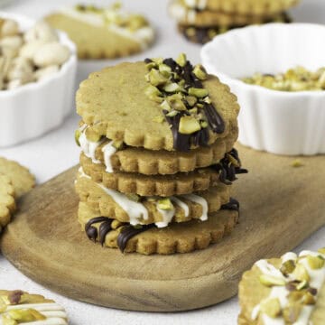 Close on up on a stack of cookies over a wooden board.