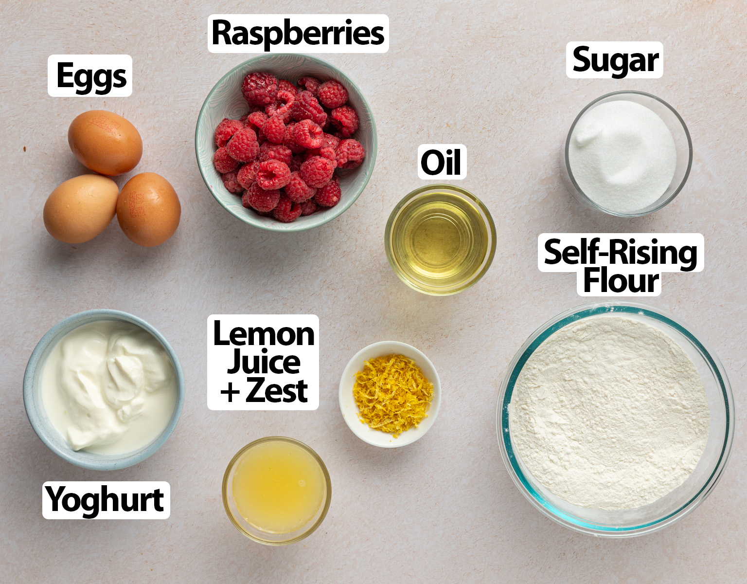 Ingredients laid over a beige surface.