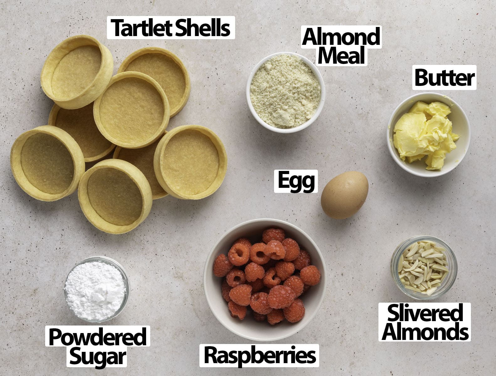 Ingredients laid on a light beige surface.
